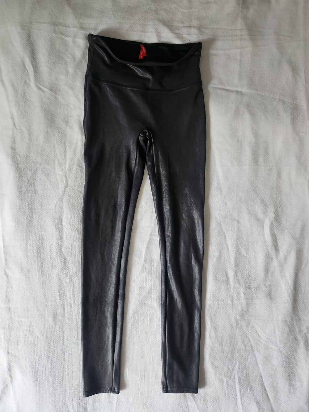 EUC Spanx black faux leather leggings in a size 6-8